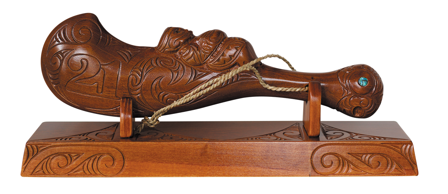 Carved 21st Wahaika on a base